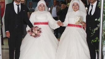 İkizlerin en mutlu günü: Aynı düğünde dünyaevine girdiler