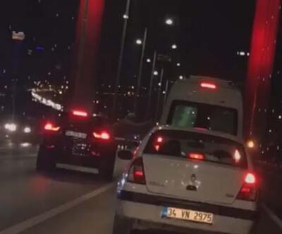 15 Temmuz Şehitler Köprüsünün ortasında camdan sarkıp tartıştığı şoföre vurmaya çalıştı