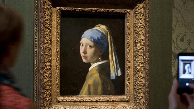 Climate activists attacked again!  This time the target is 'Girl with a Pearl Earring' painting